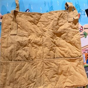 Yellow Quilted hanging organizer for baby room